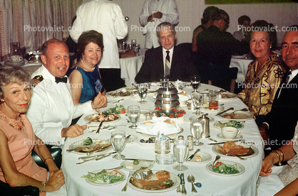 Formal Dinner, Ships Captain, Captains Table, Cooked food, meat, steak, men, women, formal attire, 1950s