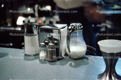 Salt and Pepper Shaker, Napkins, Sugar, Half and Half, milk, counter top, diner, December 1964