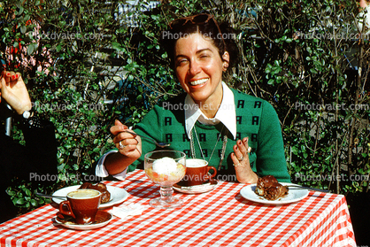 Table, Woman, Smiles, Checkerboard Tablecloth, Exterior, Outside, Outdoors, March 1975