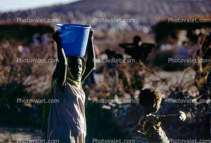 Woman with Water Bucket, Refugee Camp, Somalia