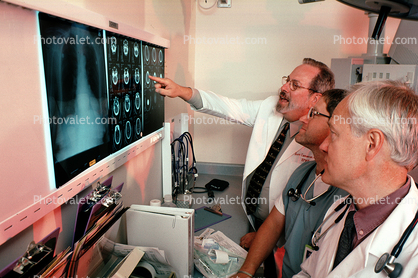 Doctors Looking at X-Ray, light box, Woman, Men