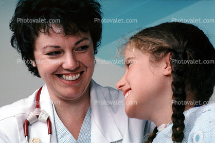 Doctor and girl patient, smiles, Female, Woman