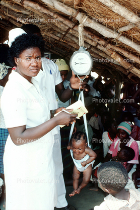 Nurse, Weighing a Toddler, Rushinga Zimbabwe