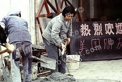 Woman mixing cement, Shanghai, China