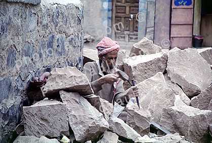 smoothing rocks and boulders, man, hammer, Al Hajjara, Yemen