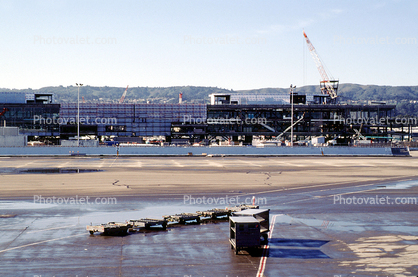 Airport Construction, baggage carts, crane, buildings, terminal