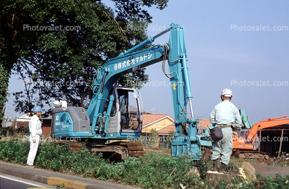 Crawler Excavator, crane, construction workers