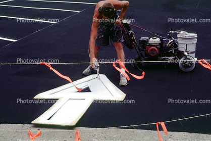 arrow, painting, paint, painter, direction, directional, man working, stencil, spray, parking lot