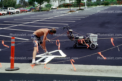 arrow, painting, paint, painter, direction, directional, man working, stencil, spray, parking lot