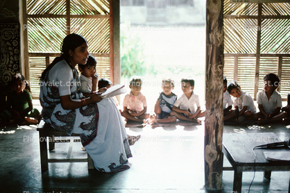 Teacher reading to the children, Schoolroom, Sevagram, India, 1984, 1980s