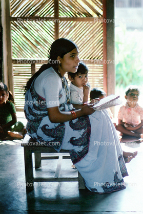 Teacher Reading, boy, sari