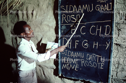 Teacher Teaching the ABC's on Chalkboard, classroom, Student, Coriolei