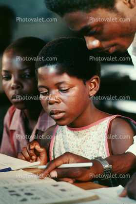 Girl learning to read, Reading, Teacher, Madzongwe