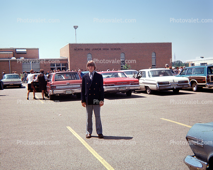 Cars in a Parking Lot, Boy in formal suit, Elkhart, 1960s