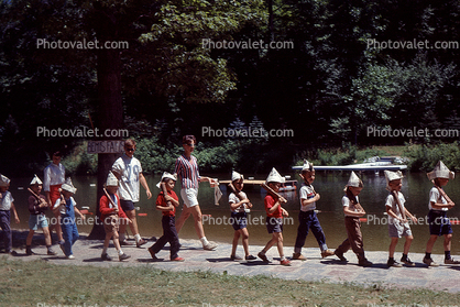 Schoolkids marching with Rifles