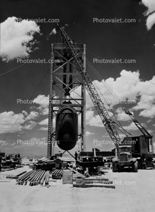 First Atom bomb, Trinity Test Site, prepping bomb for the first explosion test, crane, 1945, 1940s