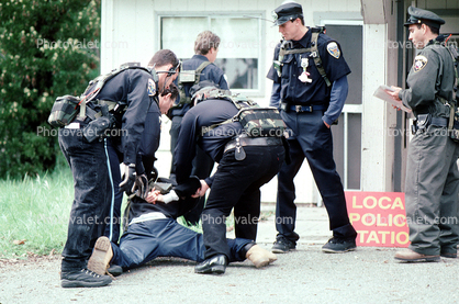 Police arrest a boy, resisting arrest, handcuffed, Policeman, Operation Kernel Blitz, urban warfare training