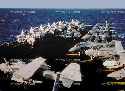 Intruders and Tomcats resting, A-6, F14, parked on the Bow