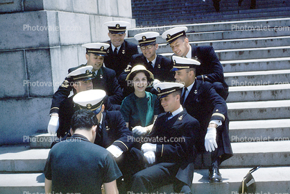 guys surround a girl, Panama City, smiles, hats, suit, USN