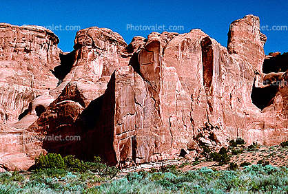 Sandstone, Cliff, stratum, strata, layered, sedimentary rock, scrub brush, bush, tower