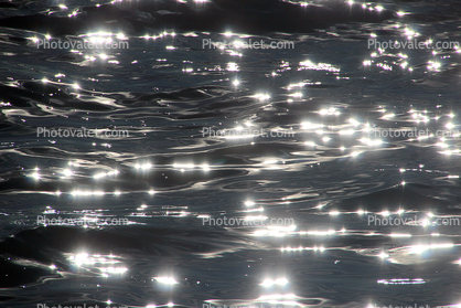Ripples upon the Silvery Sparkly calm of the Pacific Ocean, peace, gentle, abstract