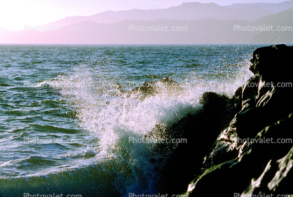 wave onto the shore rocks