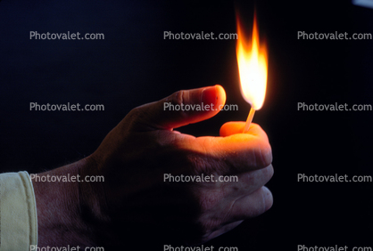 thumb strikes a flame, self striking match