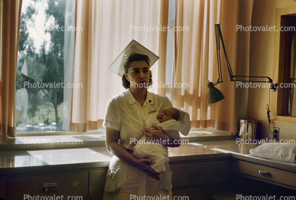 Nurse with Newborn Baby, Hospital, 1950s, Childbirth