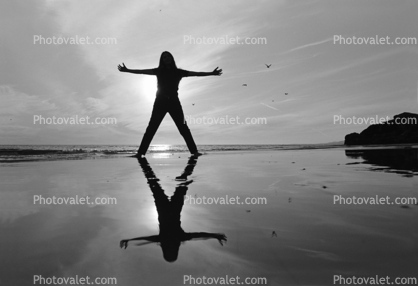 Here Now Reflective Now, Woman on the Beach with outstretched arms