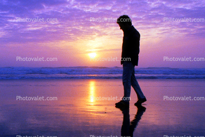 Man Walking in the Ocean Sunset