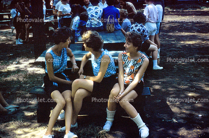 Women sitting at a picnic table, 1950s