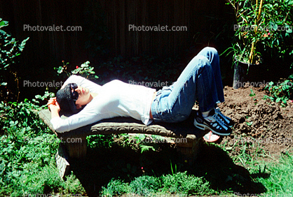 Woman Relaxing on a Curved Bench