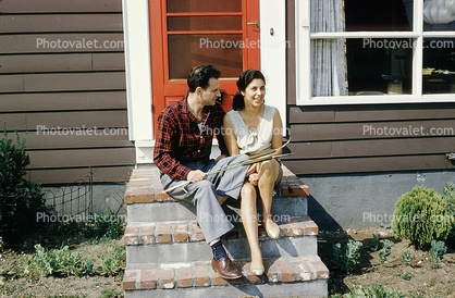 Couple sitting, home, house, stairs, 1950s