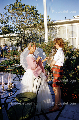 Women, backyard, belle dress, April 1960, 1960s