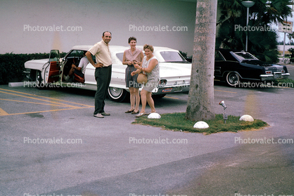 Cadillac, car, women, man, parking, August 1964, 1960s