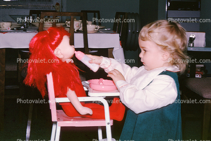 Girl Bottle Feeding her redhead doll, Toddler, 1950s