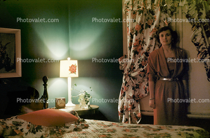 Woman, Lamp, night table, bed, curtains, 1940s