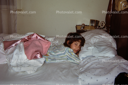 Girl Trying to Wake-up, Pillows, blankets, Bed, sheets, headboard, 1960s