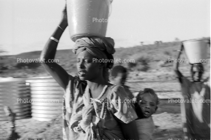 Girl carry's water bucket, Somalia Refugee Camp