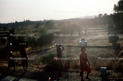 Women carrying water, India
