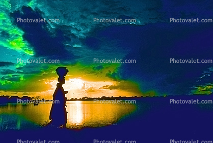 Woman Walking in the Sunset, Clouds, Lake