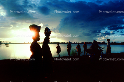 Women Walking in the Sunset, Clouds, Lake
