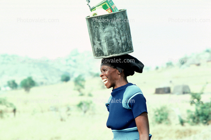 Woman smiling, bucket
