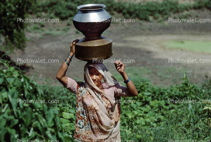 Woman Balances Metal Water Containers, Bayad Taluka, Gujarat