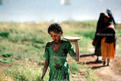 Girl Carries a Plate with Food, Dress