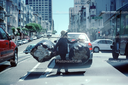 Chinese Woman with a huge load of Recyclables, California Street, cars, crossing