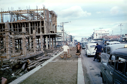 building construction, sidewalk, cars, Bangkok, Thailand, October 1962, 1960s