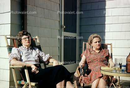 Women, Chairs, Relaxing, Larchmont, New York, home, house, door, dresses, glasses, 1947, 1940s