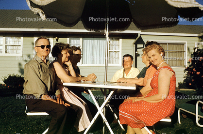 Backyard, Man, Woman, Parasol, Columbus Ohio, July 1960, 1960s