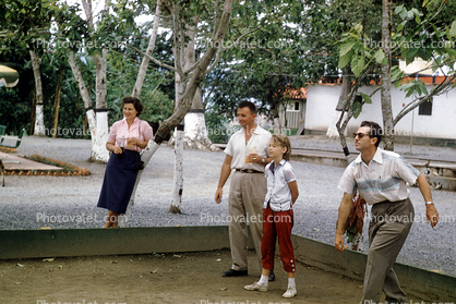 Playing Horseshoes, men, women, girl, Caracas Venezuela, 1957, 1950s